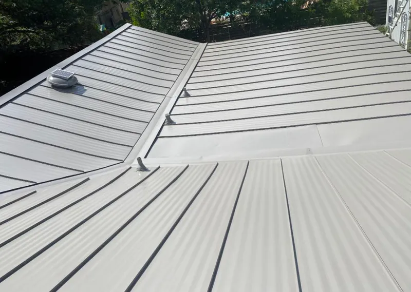 Solar attic fan installed on a metal roof for Roof Ventilation in South Brunswick